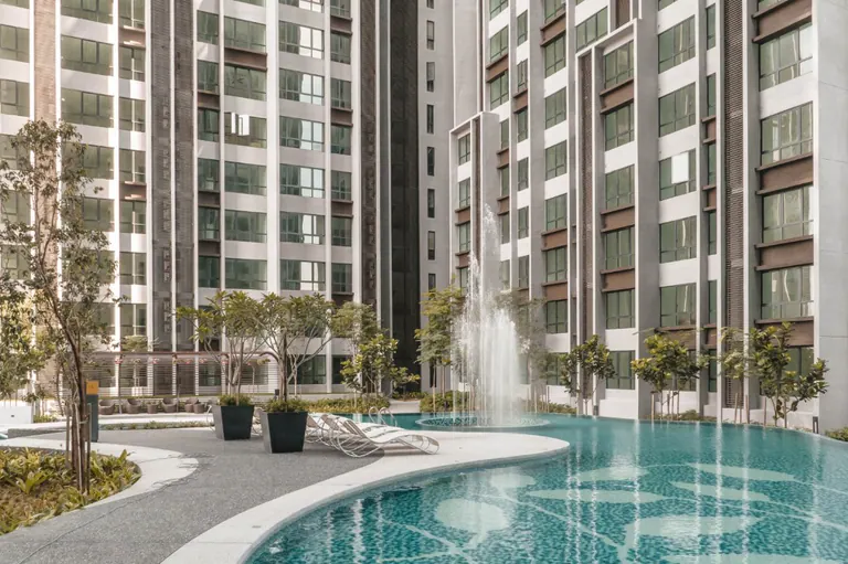 Landscaped swimming pool and residential buildings at Cubic Botanical.